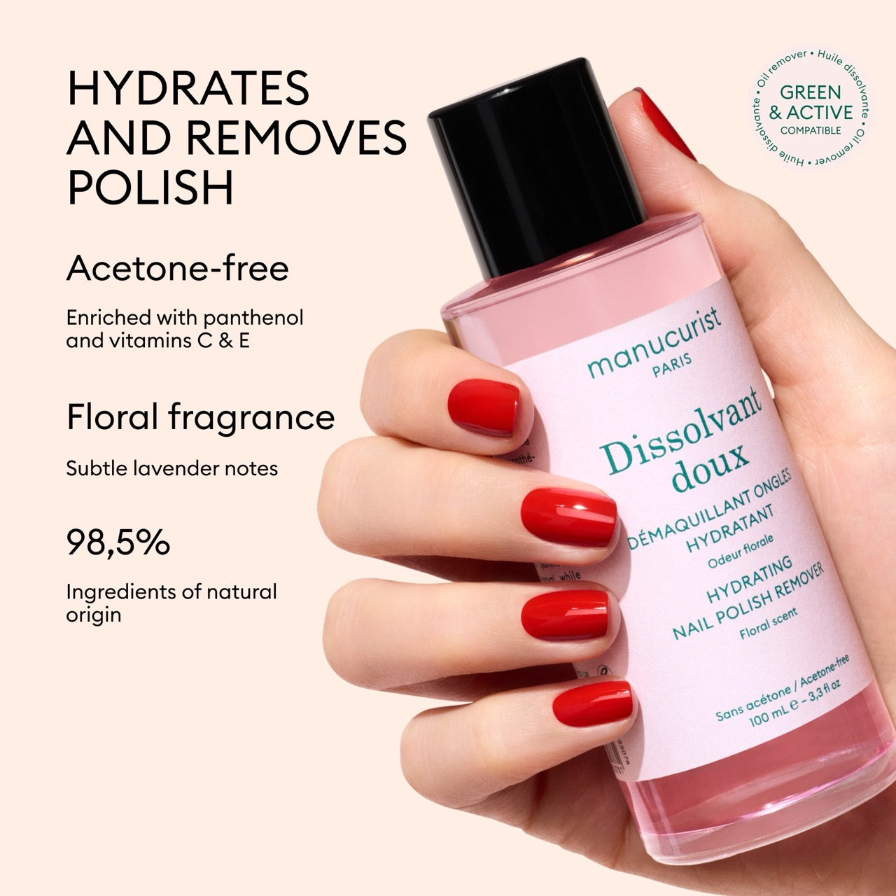 A hand with red-painted nails holds a pink bottle of Manucurist Gentle Remover. This acetone-free nail polish remover is 98.5% natural, floral-scented, and enriched with panthenol plus vitamins C E to strengthen nails while cleansing.