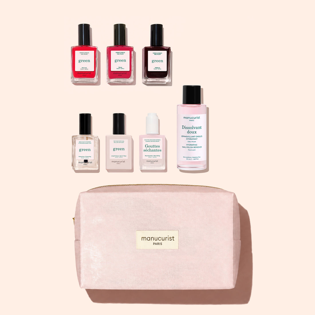 The Manucurist Starter Kit features plant-based nail polishes, nail care essentials, and a pale pink manicure bag labeled “manucurist PARIS,” all elegantly arranged on a light background for a sophisticated green manicure experience.