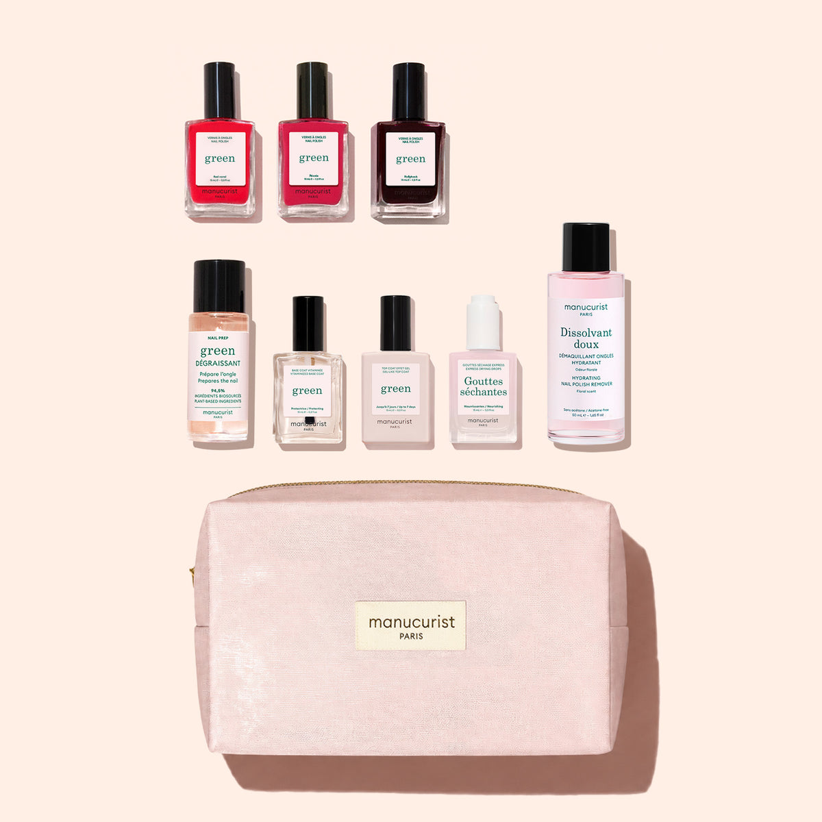 The Manucurist Starter Kit is displayed on a pale pink background, featuring a pink manicure kit bag with seven neatly arranged manicure essentials above it—including three plant-based nail polishes, a remover, and nail care bottles.