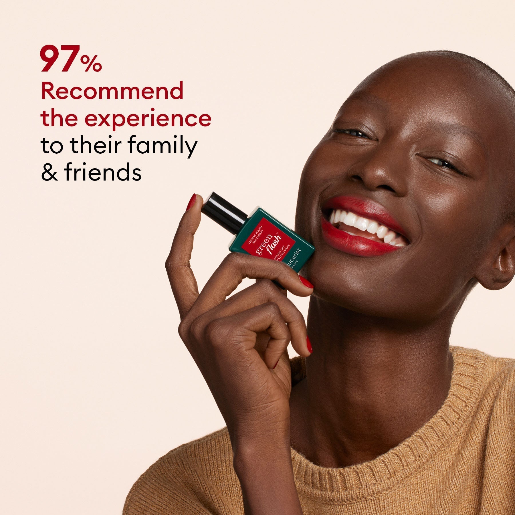 A smiling person with smooth dark skin holds the Manucurist-test Green Flash™ Welcome Kit gel polish near their face. Red text reads: 97% would recommend the experience to family friends. The person wears a tan sweater and red lipstick.