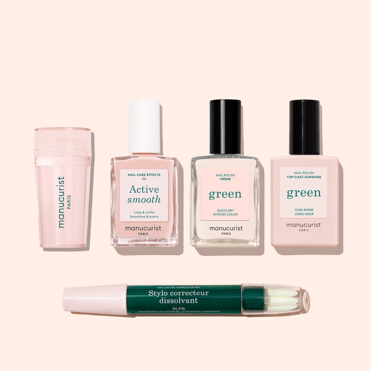 Five Manucurist French Active™ Kit nail care products are displayed on a light beige background: cuticle cream, nail care effects serum, two green polishes from the kit, and a double-sided green and white corrector pen.