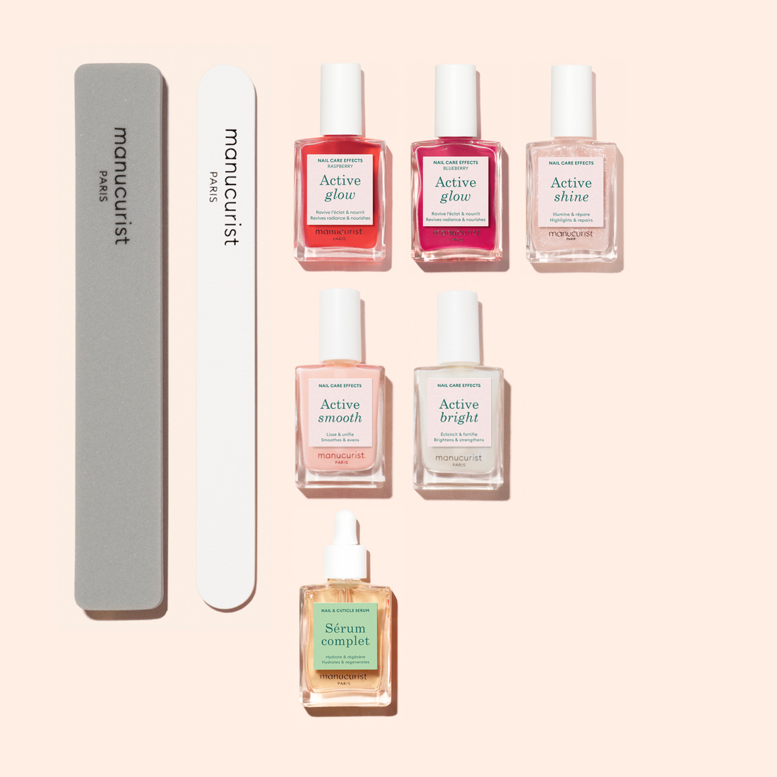 The Super Active Manicure Kit by Manucurist US features six nail polishes, a grey nail file, and a dropper bottle—arranged on a light peach background. Polishes include Active glow, shine, smooth, and bright for complete nail care.