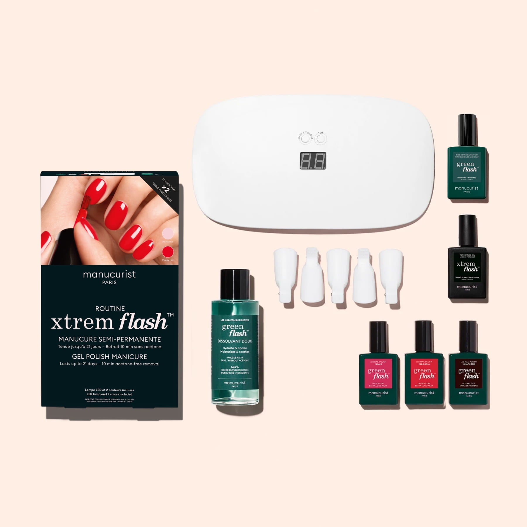 The Manucurist Starter Kit includes a UV lamp, multicolored gel polishes, vitamin-infused base coat, remover bottle, nail clips, and comes in a box labeled "Manucurist Xtrem Flash" with an image of glossy red nails.