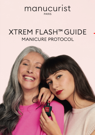 Two women, one older with long gray hair and one younger with dark hair and bangs, stand together smiling. The younger woman holds Leaflet Xtrem Flash™ (B2C) by Manucurist-test. Text above reads: Manucurist-test XTREM FLASH™ GUIDE MANICURE PROTOCOL.