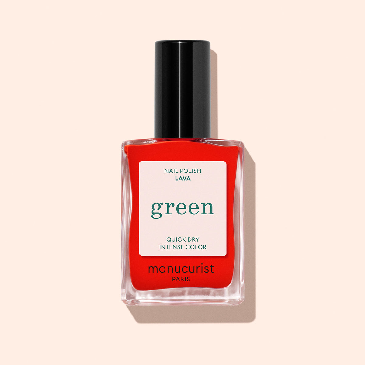 A bottle of Manucurist Lava nail polish, a fiery red shade with warm orange undertones, black cap, and white label, shown on a light beige background.
