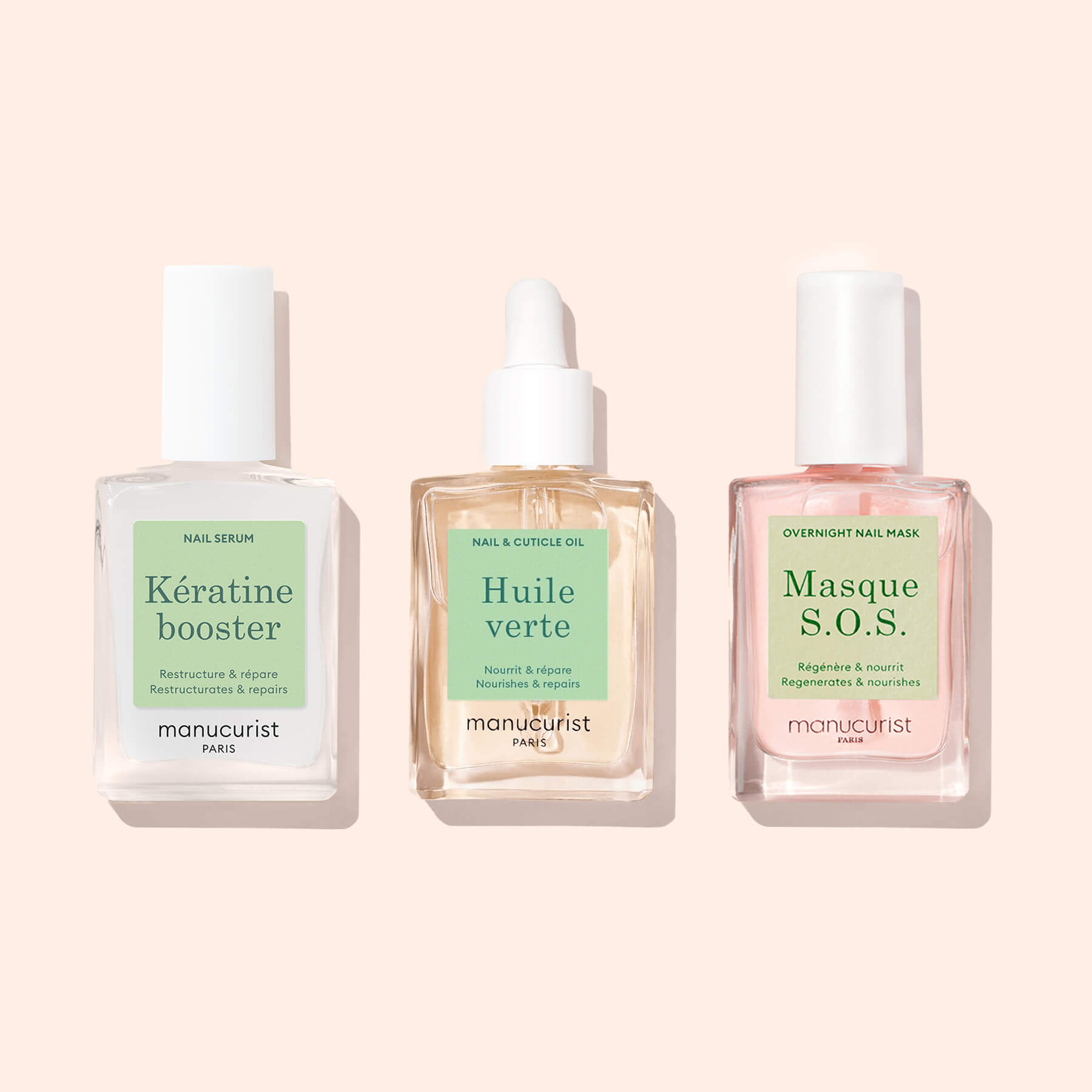 Three clear Manucurist bottles from the Starter Routine - Damaged Nails set are arranged side by side on a light pink background, ready to deliver effective nail repair for damaged nails.