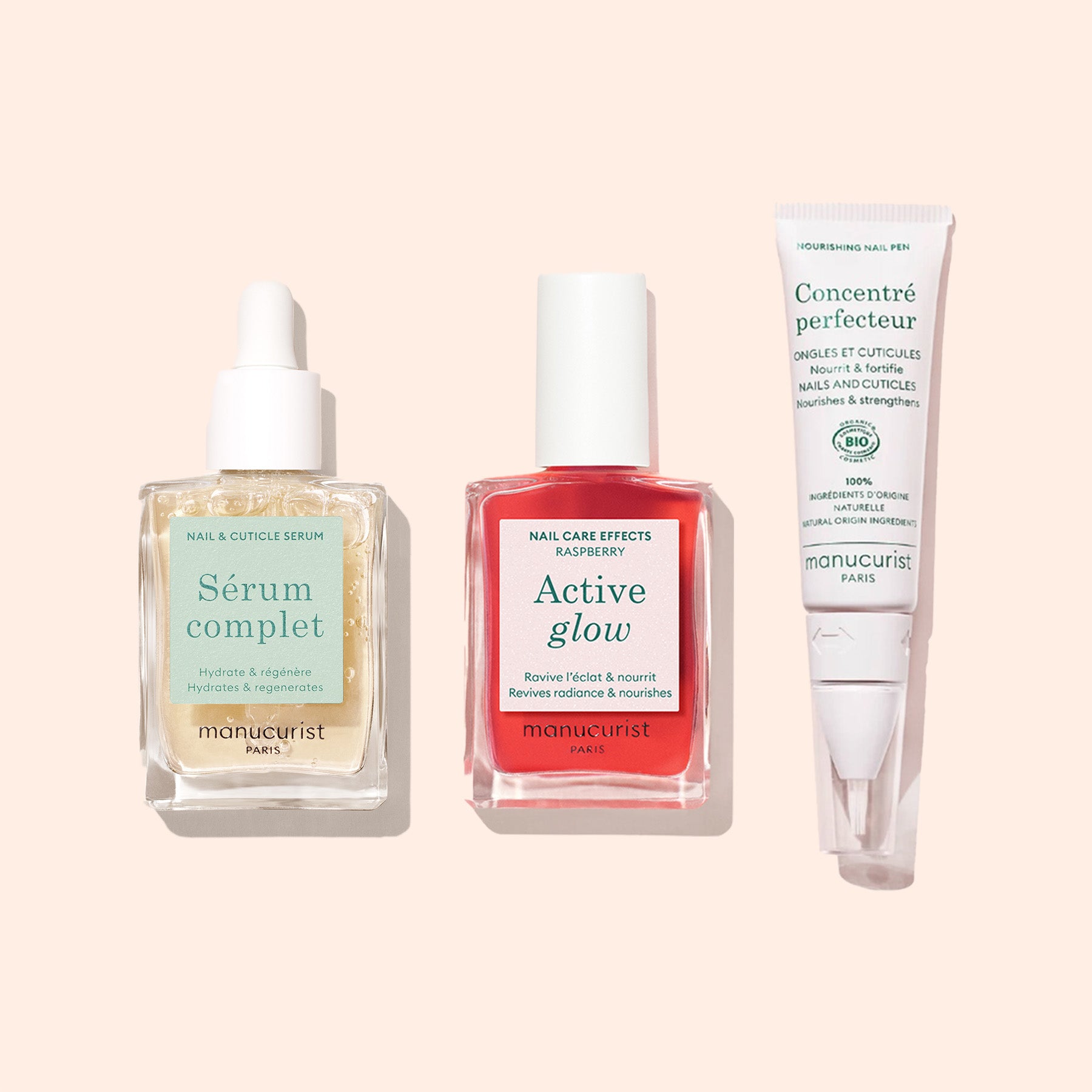 The Basic Routine - Sensitive Nails from Manucurist Paris includes a nail rescue serum, raspberry nail care polish, and a moisturizing nail and cuticle cream on a light beige background.