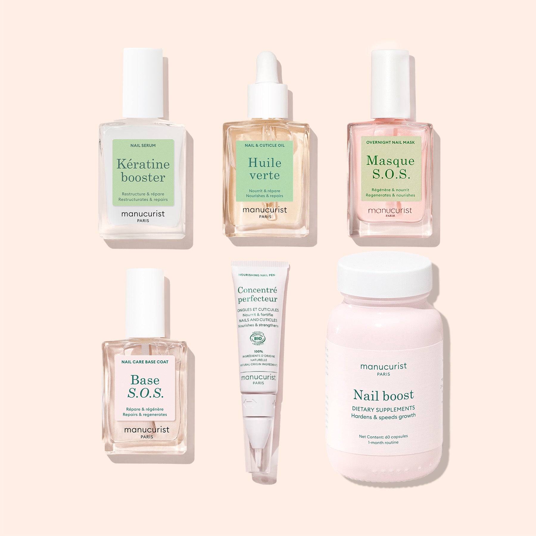 Six Manucurist Ultimate Routine - Damaged Nails products, including serums, a mask, a supplement bottle, and nail repair creams, are arranged on a light beige background with Manucurist branding visible on the bottles and tubes.