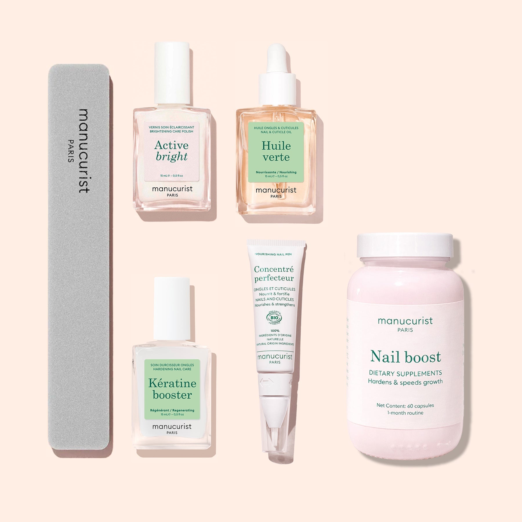 The Manucurist Ultimate Routine - Yellow Nails set features five expertly arranged nail care essentials—including files, serums, supplements, and creams—on a pale backdrop, ideal for strengthening and brightening your nails.