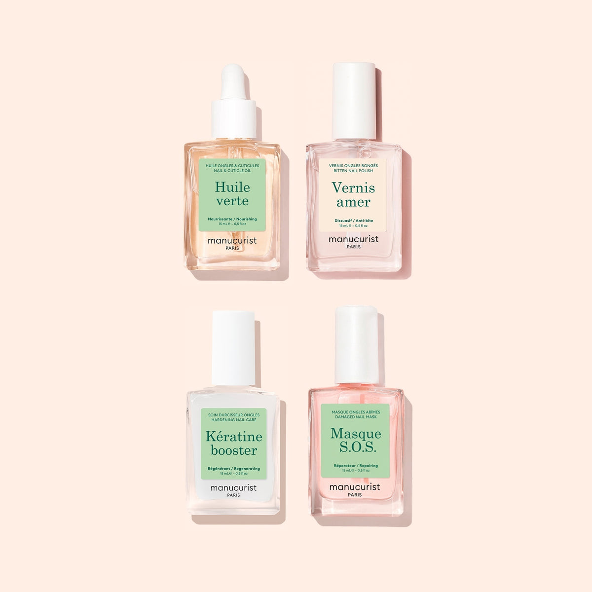 Quatre flacons du coffret Routine Ultime - Ongles Rongés de Manucurist, chacun doté d&