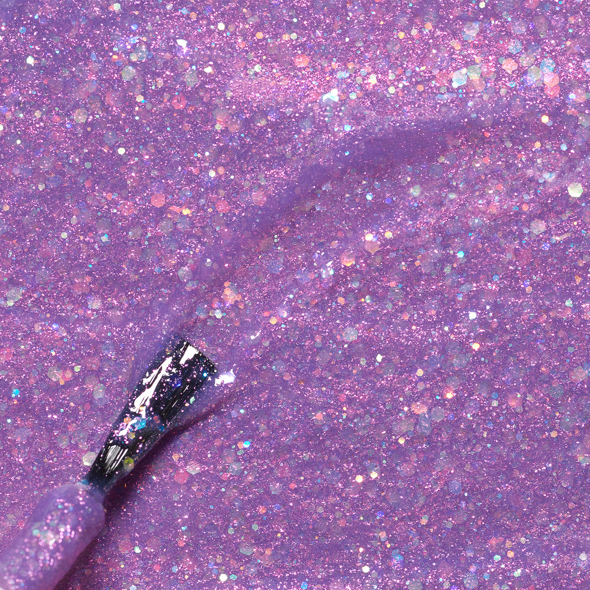 A close-up of a brush applying Manucurist’s Scarlett the Owl kids&