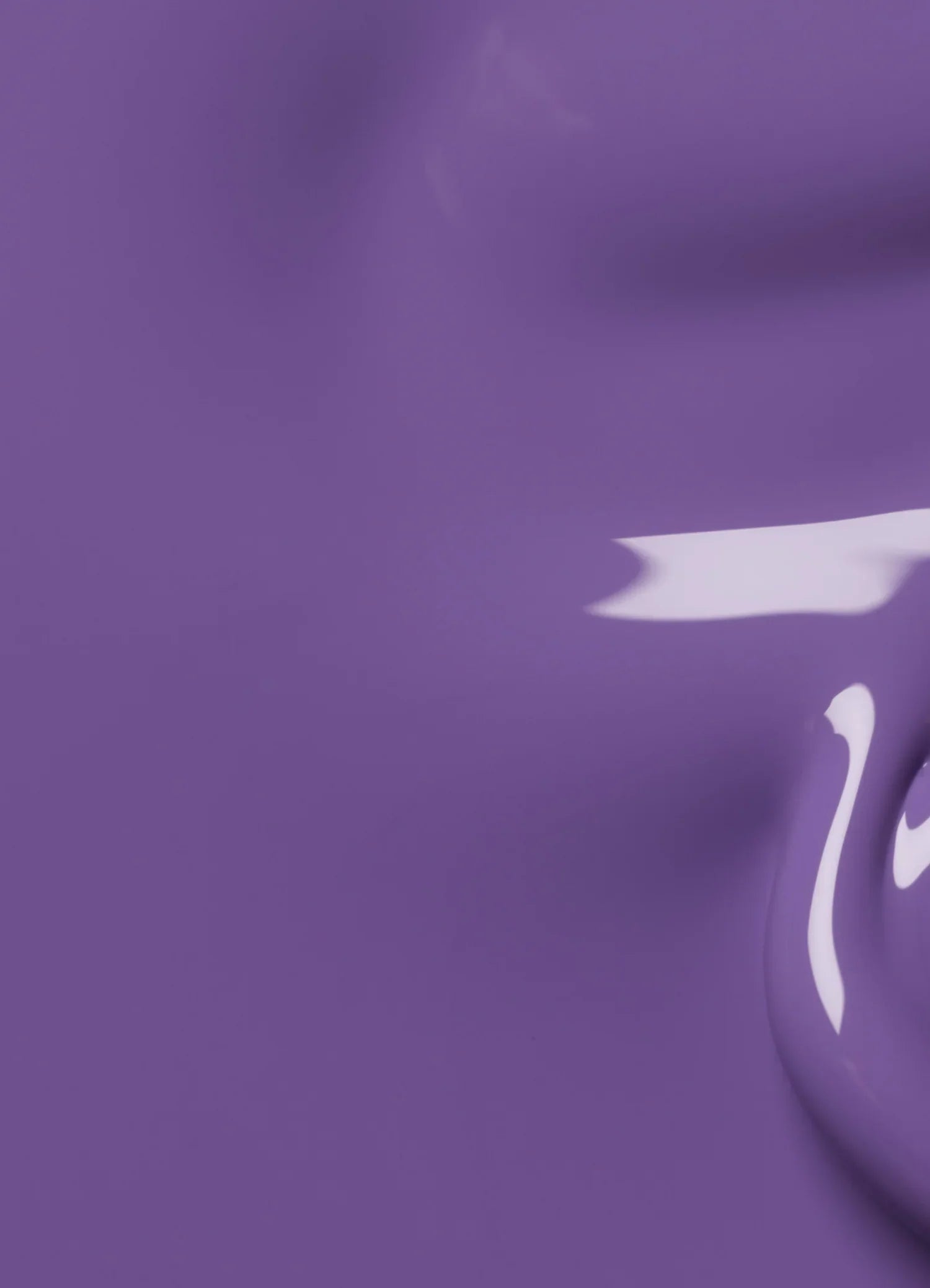 A close-up view of glossy purple paint with a shiny, smooth surface and a reflective highlight.