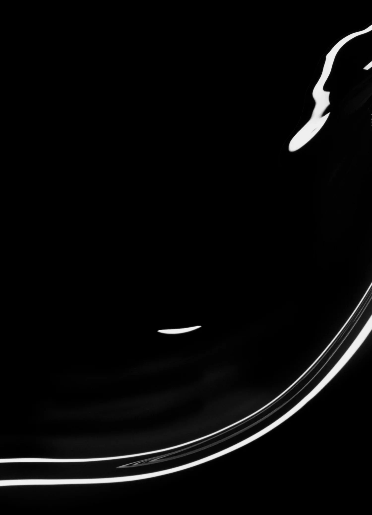 A minimalistic image featuring a black background with smooth, curved white lines and reflections, creating an abstract, flowing design in the lower right corner.
