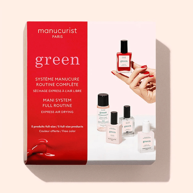 A box of Manucurist System Green Red, featuring nail polish bottles and a hand applying red polish, with red and white packaging displaying product images on the front.
