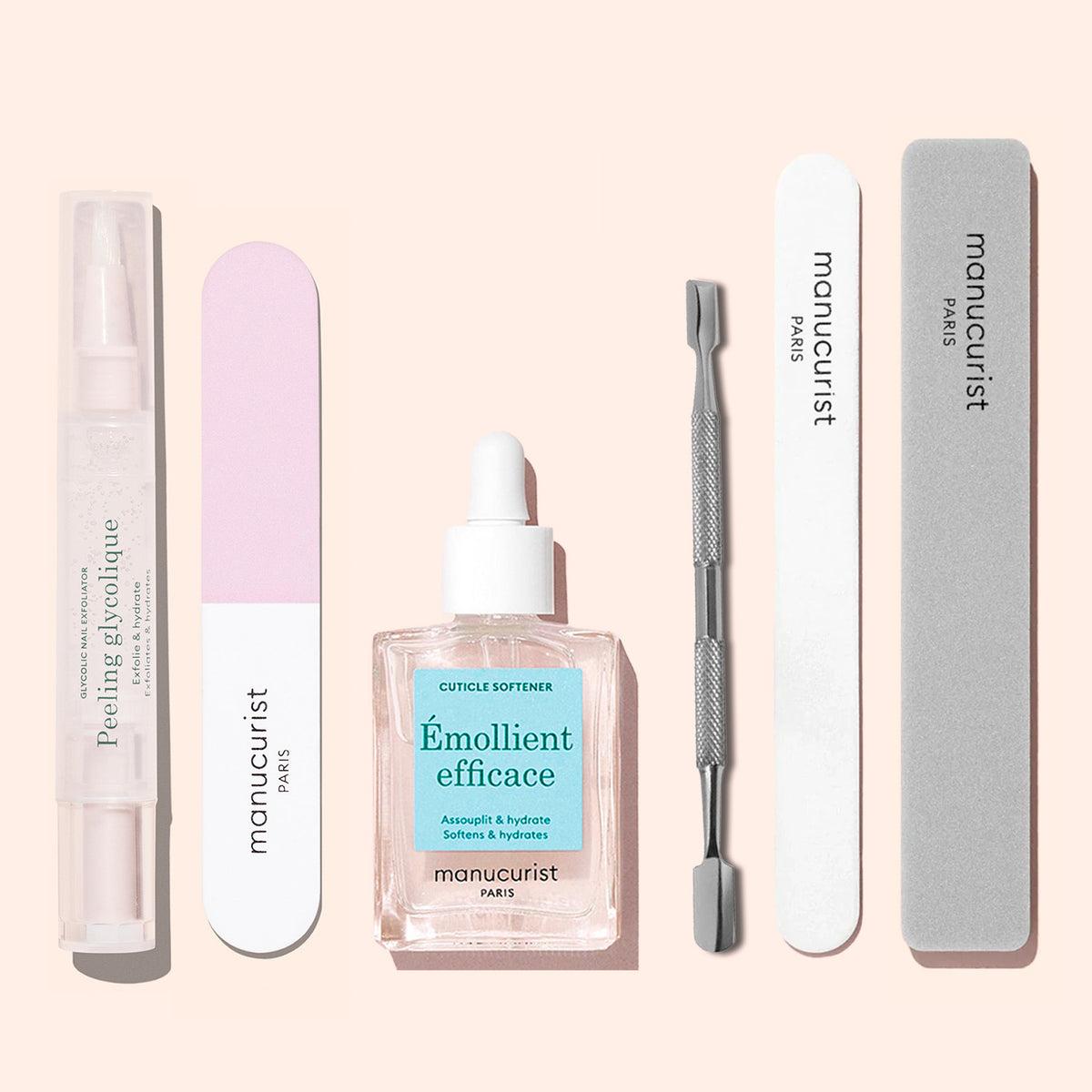 The Manucurist Prep Glow Routine set features a cuticle softener dropper bottle, gray file, pink and white buffer, metal cuticle pusher, peeling gel pen, and white file—everything you need for the perfect nail care routine.