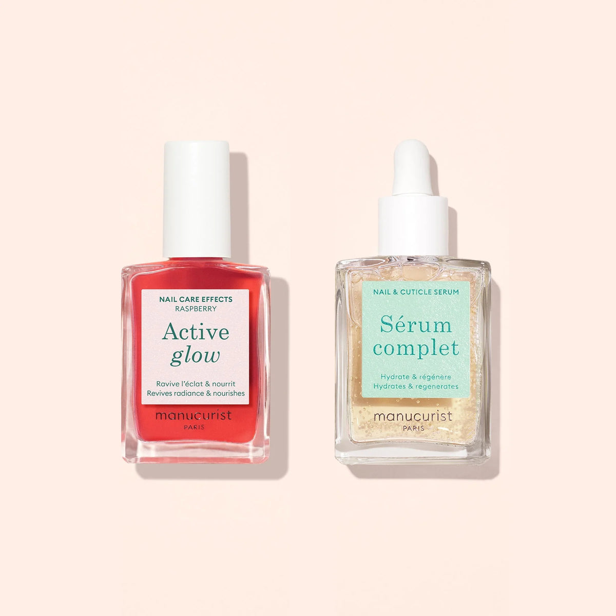 Le Duo Healthy Glow de Manucurist comprend deux sérums pour les ongles — Active Glow (rose) et Sérum Complet (transparent) — présentés sur un fond beige clair, conçus pour nourrir et embellir les ongles.