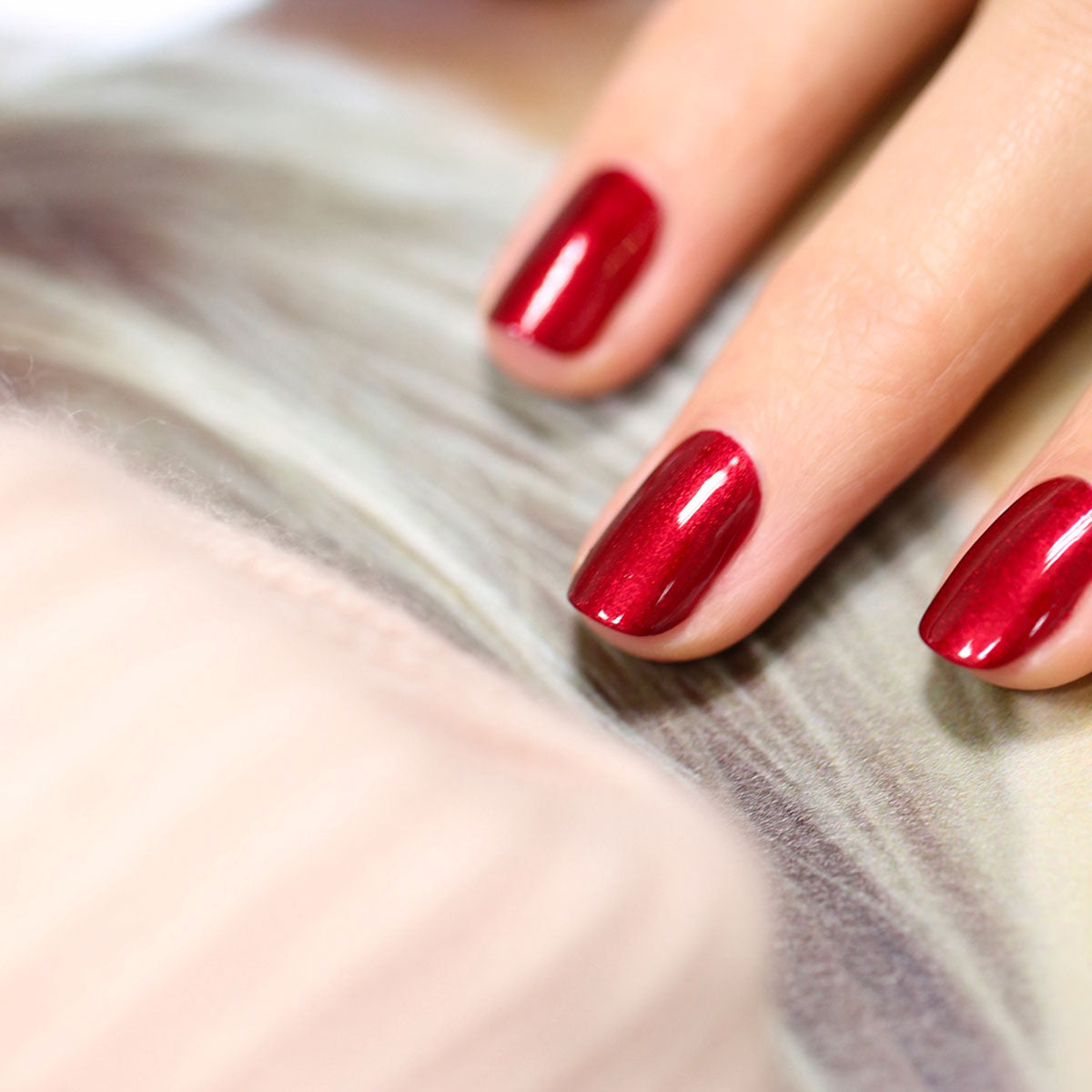 A close-up of a hand with neatly manicured nails painted in Manucurist&