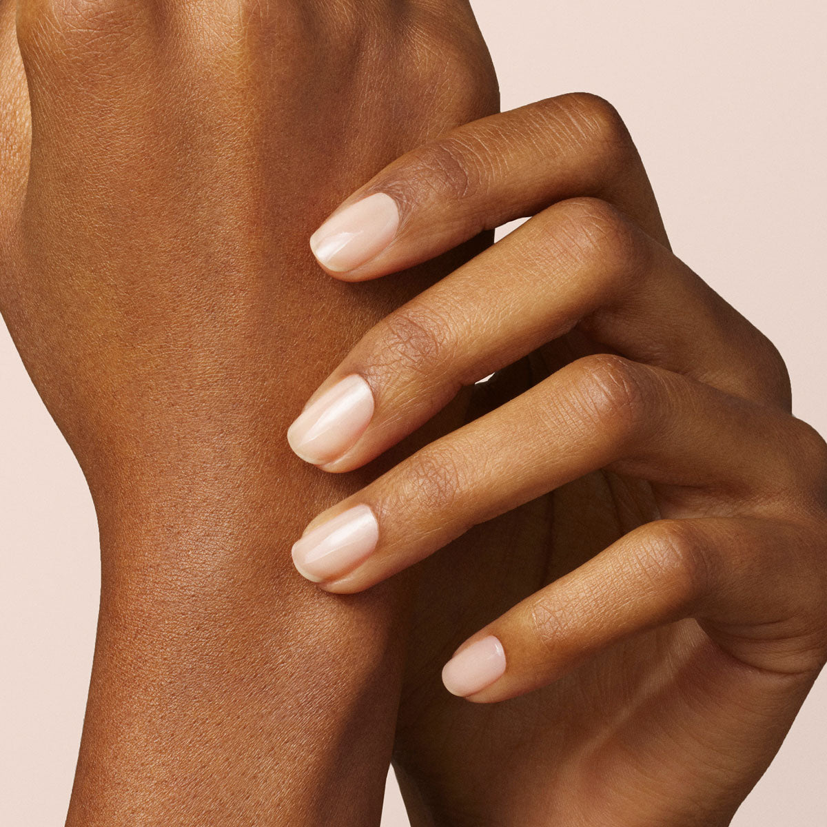 A close-up of a hand with neatly manicured nails painted in Manucurist&