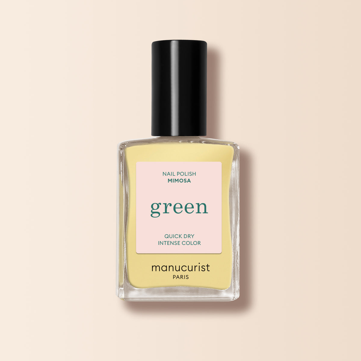 Un flacon de vernis à ongles jaune pastel Mimosa Manucurist de la gamme Green™, doté d&