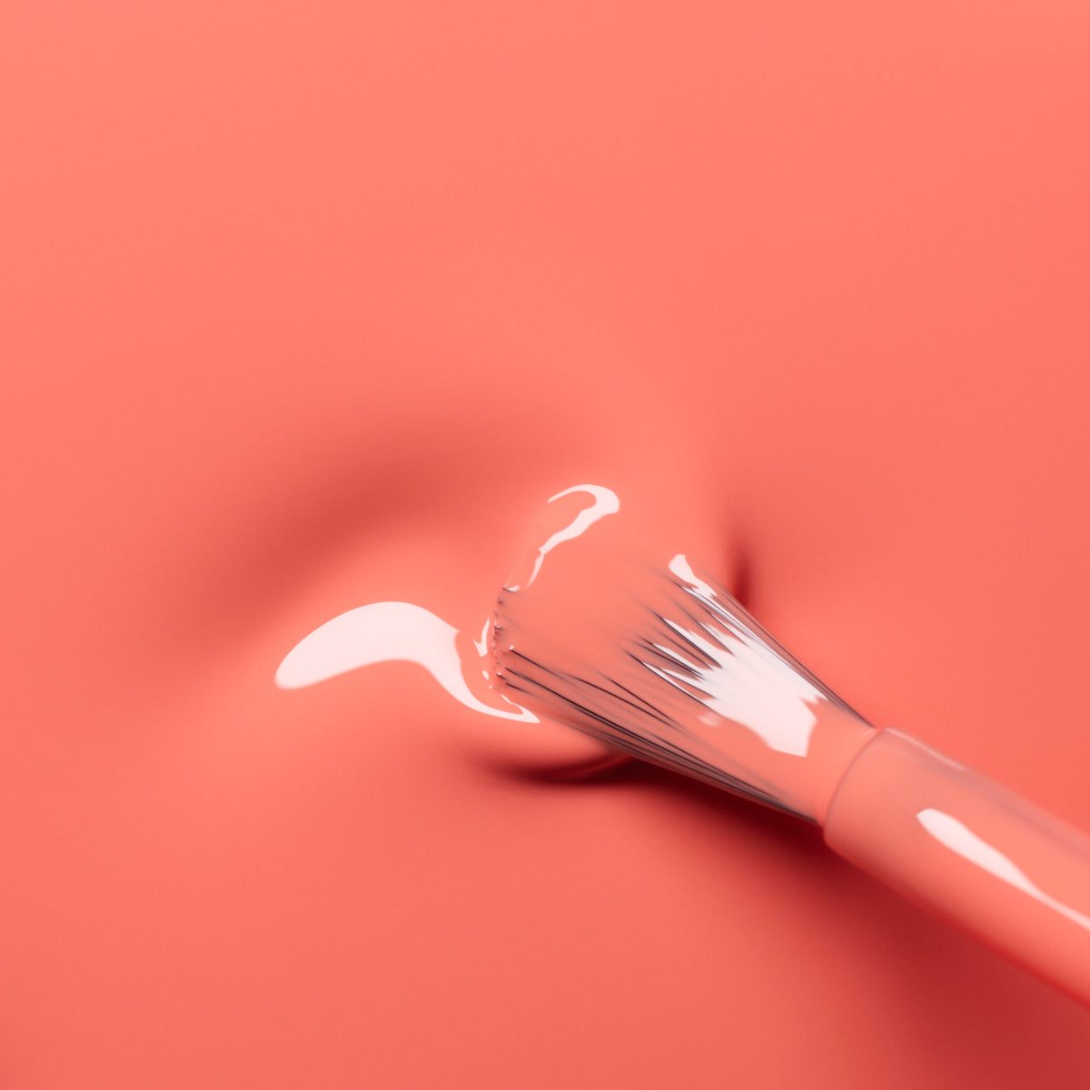 A paintbrush with pink bristles spreads shimmering Bird of Paradise polish by Manucurist across a soft pink surface, creating a minimal scene with matching tones that evoke elegance.