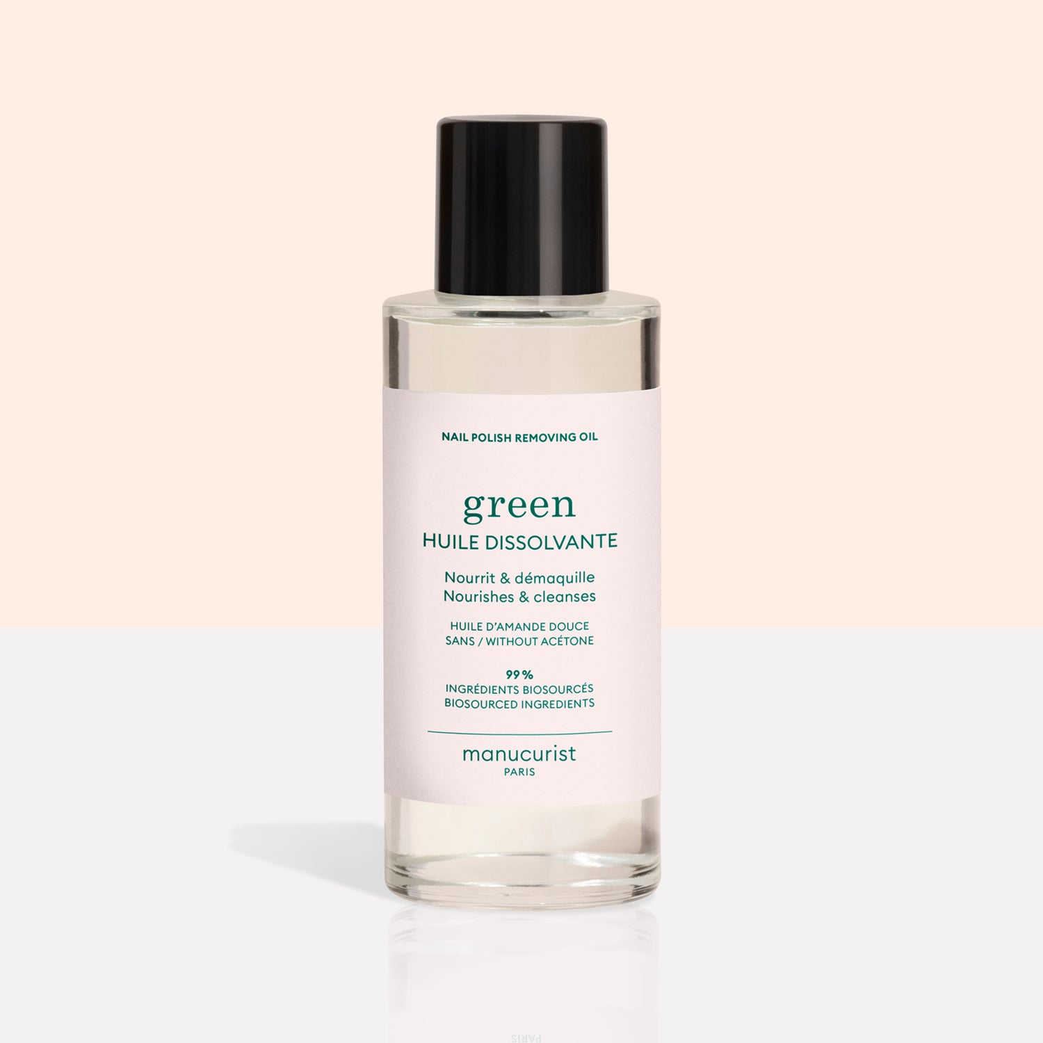 A clear bottle from the Manucurist Green™ Base, Top Coat  Nail Polish Remover Trio, featuring a black cap and pale pink label, is displayed on a light background—perfect for effectively removing even the most stubborn green nail polish or gel-effect manicure.