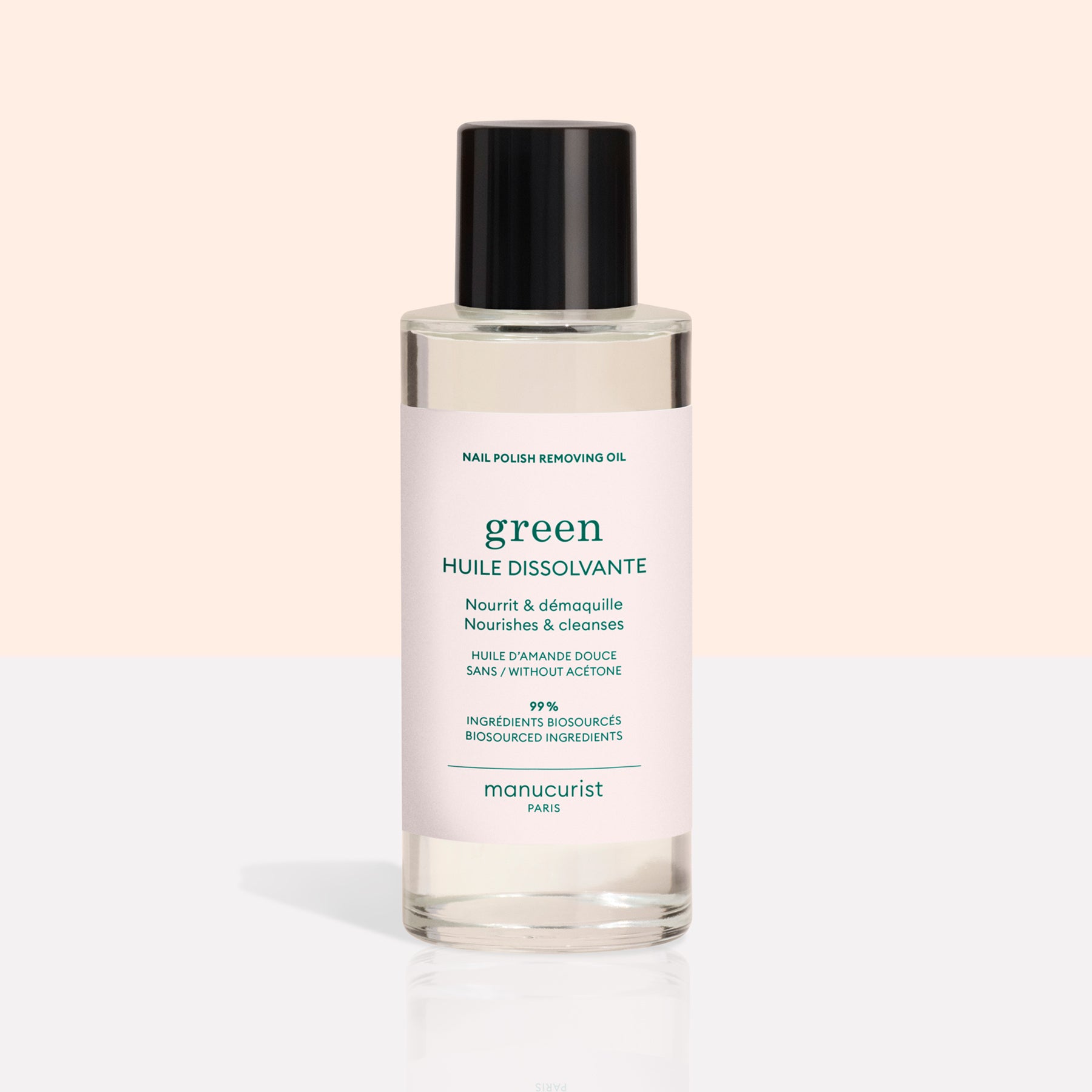 A clear bottle from the Manucurist Green™ Base, Top Coat  Nail Polish Remover Trio, featuring a black cap and pale pink label, is displayed on a light background—perfect for effectively removing even the most stubborn green nail polish or gel-effect manicure.