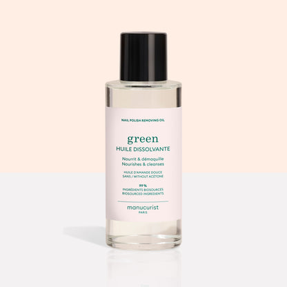 A clear bottle from the Manucurist Green™ Base, Top Coat  Nail Polish Remover Trio, featuring a black cap and pale pink label, is displayed on a light background—perfect for effectively removing even the most stubborn green nail polish or gel-effect manicure.