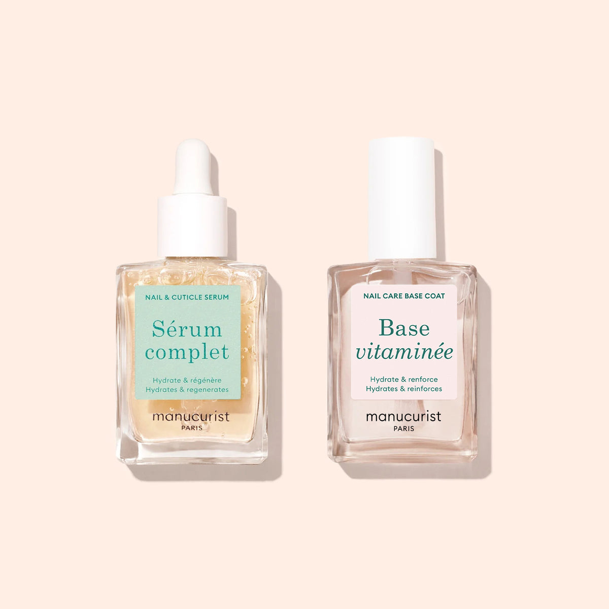 Deux flacons en verre transparent avec pipette — Duo Hydratation Ongles Manucurist — sont présentés sur un fond beige clair, conçus pour préserver la santé des ongles et offrir une hydratation riche en vitamines.