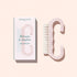 A translucent pink Nail Brush with vegan bristles and white tips from Manucurist-us rests next to its box, which displays an image of the brush and the words “Manucurist Paris, Brosse à ongles, NAIL BRUSH,” set against a pale background—ideal for enhancing your manicure routine.
