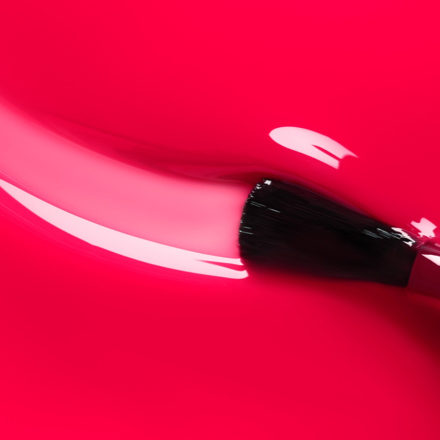 A close-up of a makeup brush applying Manucurist’s Pomme d&