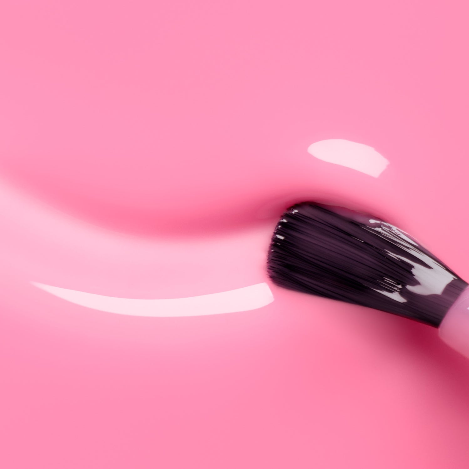 A close-up of a brush applying Manucurist&