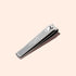 A silver Manucurist Nail Clipper, featuring the brand name engraved on its surface, is placed on a light beige background.