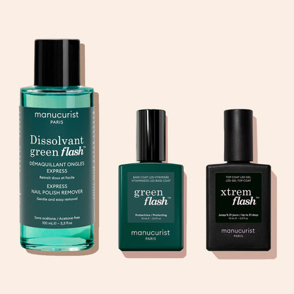 Three manicure essentials from Manucurist: Green Flash™ Gel Polish Remover, Green Flash base coat, and Xtrem Flash top coat in green and black packaging set against a light background.