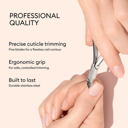 A person using Manucurist Cuticle Clippers for precise trimming, featuring an ergonomic grip and durable stainless steel construction.