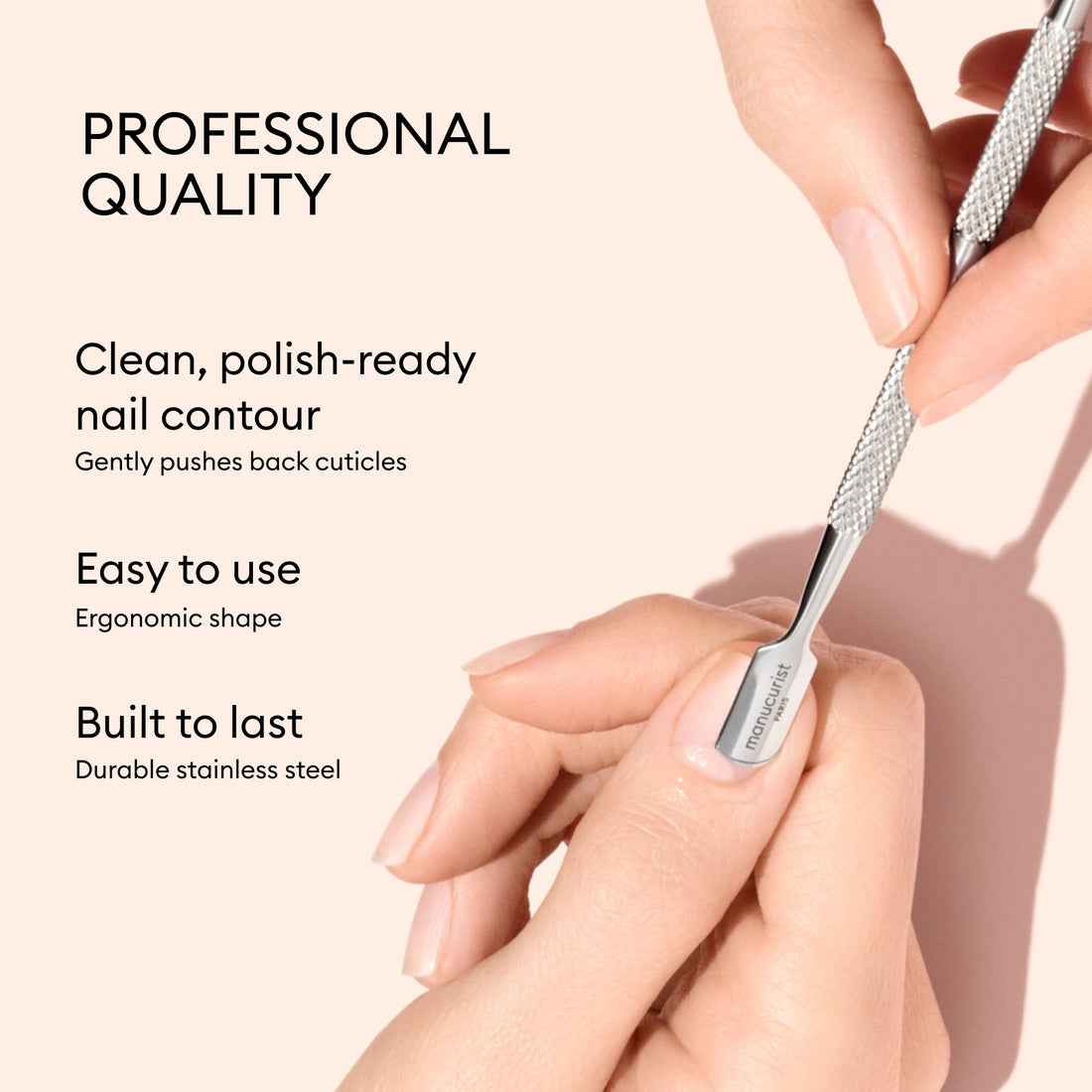 A hand uses the Manucurist Cuticle Pusher, a professional quality, ergonomic tool made from durable stainless steel that is easy to use and gently pushes back cuticles for effective nail care.