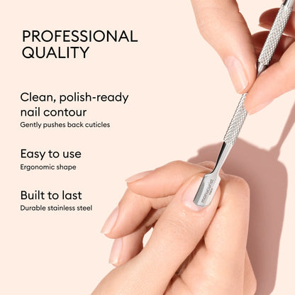 A hand uses the Manucurist Cuticle Pusher, a professional quality, ergonomic tool made from durable stainless steel that is easy to use and gently pushes back cuticles for effective nail care.