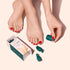 A person with red-painted toenails holds a green bottle, preparing to apply polish. Nearby, an opened Manucurist Foot Removal Clips box with gel polish pedicure removal bottles sits on a pale surface.