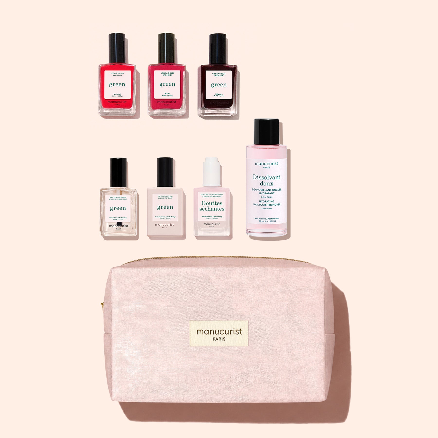 The Manucurist Starter Kit features plant-based nail polishes, nail care essentials, and a pale pink manicure bag labeled “manucurist PARIS,” all elegantly arranged on a light background for a sophisticated green manicure experience.