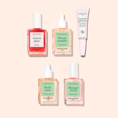 Five Manucurist Basic Routine - Sensitive Nails products, including three dropper bottles, one pump bottle, and one tube, arranged against a light background for cuticle serum application.