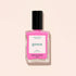 A 15 mL Manucurist Bloom neon pink nail polish with blue undertones and a black cap. The label says “green,” “Bloom,” and “15 mL – 0.5 fl oz.” The bottle casts a shadow on a light background.