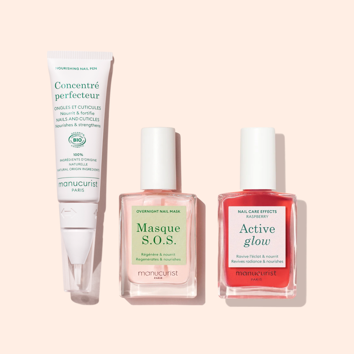 Le Duo Ongles Forts Manucurist comprend un stylo soin cuticules et un masque de nuit pour les ongles rose transparent sur un fond rose pâle pour un rituel de soin sublimé.
