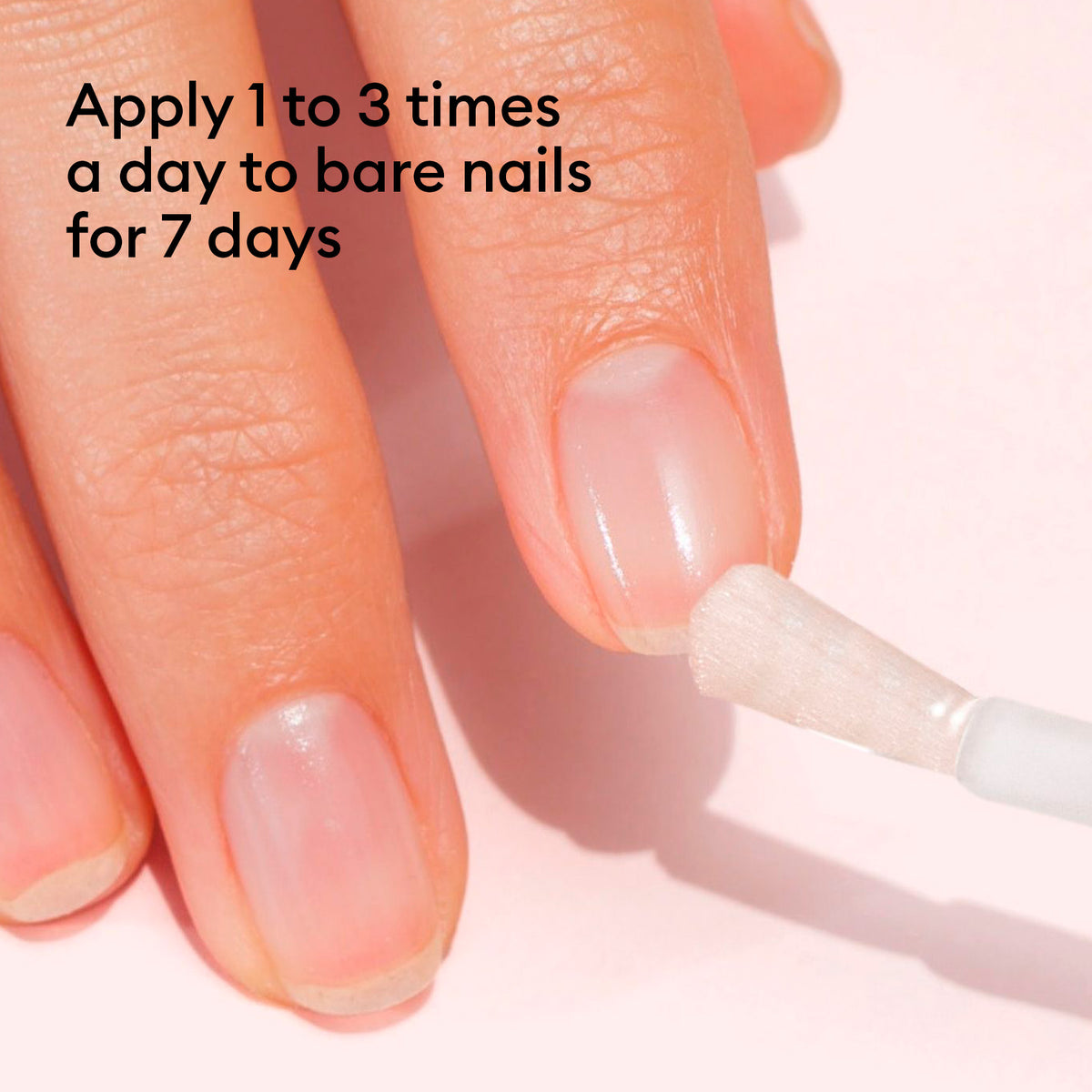 A bare-nailed hand is shown as Manucurist Nail Strengthening Serum is applied. Text: Apply 1 to 3 times daily to bare nails for 7 days for strong, healthy nails.