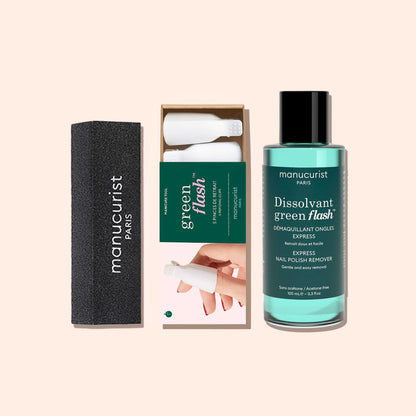 Kit de dépose rapide Manucurist-us comprenant un bloc de ponçage noir, cinq pinces à ongles blanches en plastique et un flacon de dissolvant bleu-vert.