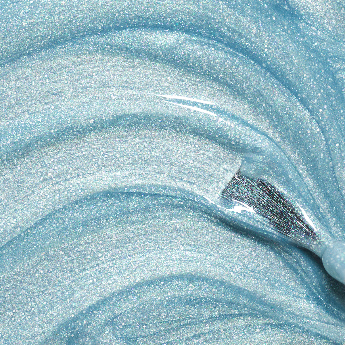 Bonnie the Mermaid by Manucurist is a shimmery, light blue gel with blue glitter and a glossy finish, swirled in smooth waves—ideal as kids&