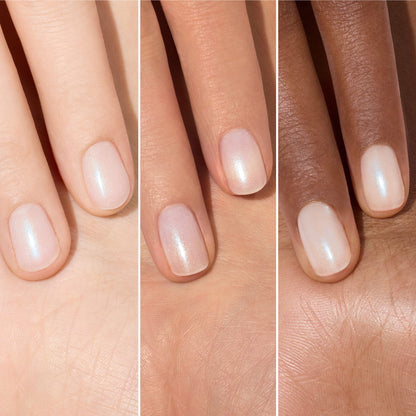 Three hands of different skin tones show hydrated nails painted with Manucurist’s Active Plump Aqua Glazed, a shimmery pale pink polish. The image is split into three vertical sections, each focusing on the glossy nails against the palm.