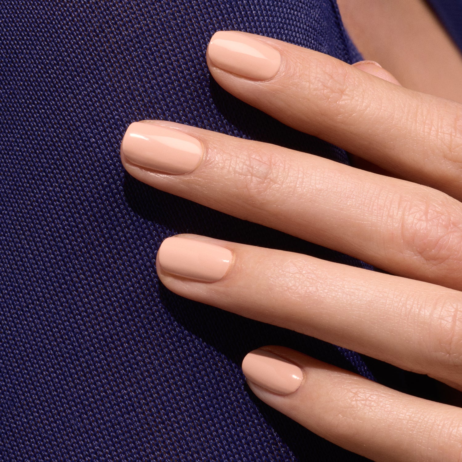A close-up of a hand with neatly manicured nails painted in Manucurist&
