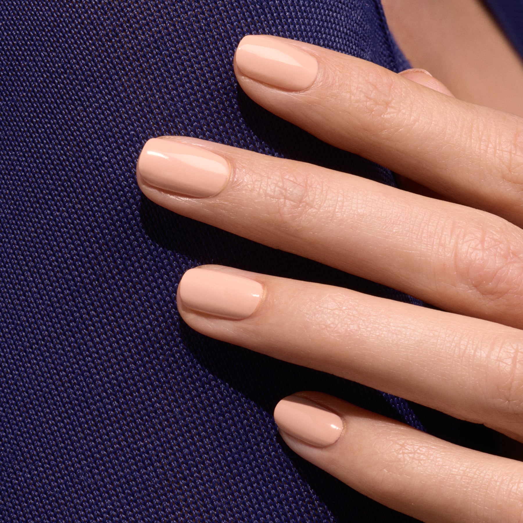 A close-up of a hand with neatly manicured nails painted in Manucurist&