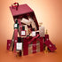 A red and pink Manucurist Advent Calendar Time to Shine! box with numbered compartments, mini gold figurines, and several nail polish bottles—including the dazzling Active™ Shine Icy—arranged among other Manucurist nail and hand care treats on a peach gradient background.