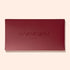 A closed, rectangular Burgundy Holiday Rainbow Box by Manucurist, with the brand name and “PARIS” embossed on the lid, set against a light beige background.
