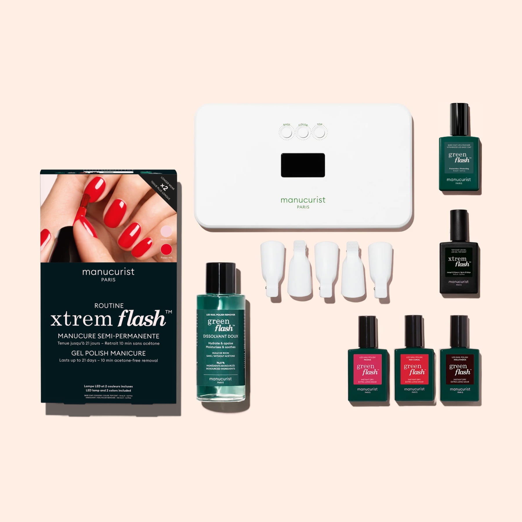 The Manucurist Starter Kit offers an ultra-glossy manicure with a nail lamp, vitamin-infused base coat, vibrant polishes, remover, nail tips, and a chic “Xtrem Flash” box—all elegantly displayed on a pale background.